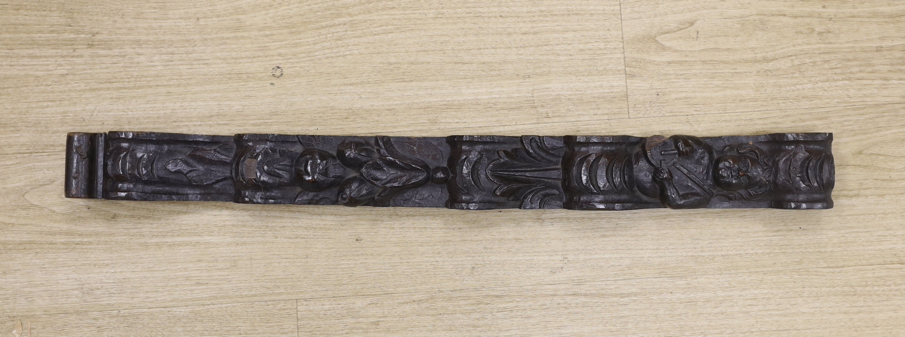 An 18th century carved oak figural pilaster, 83cm long